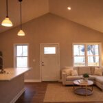 Living room with vaulted ceilings and natural light